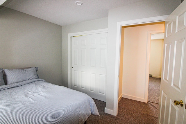 carpeted bedroom with a closet