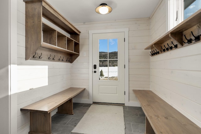 mudroom with wooden walls