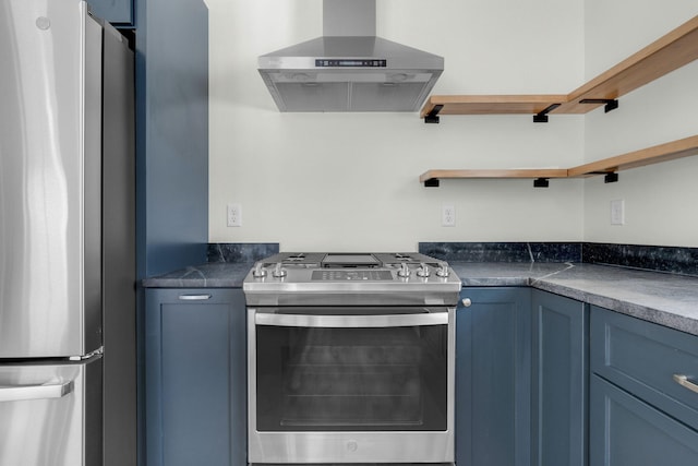 kitchen with stainless steel appliances, blue cabinets, and wall chimney range hood