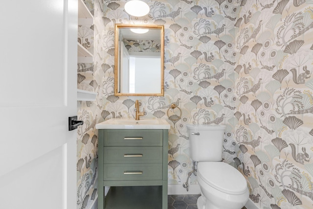 bathroom featuring tile patterned floors, vanity, and toilet