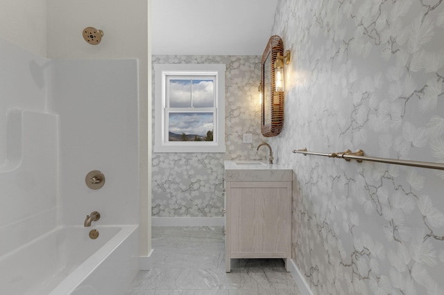 bathroom with vanity and washtub / shower combination