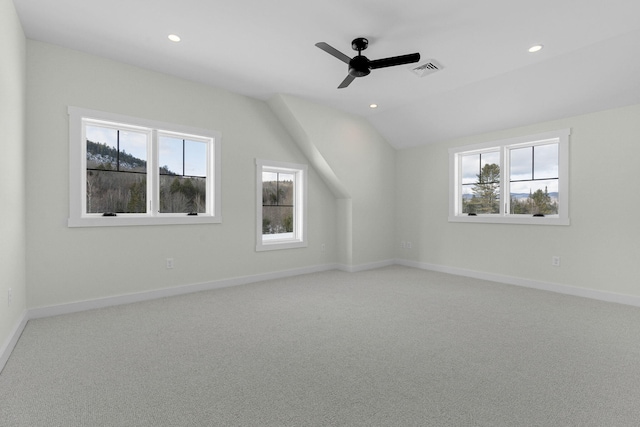 bonus room featuring carpet floors, vaulted ceiling, a healthy amount of sunlight, and ceiling fan