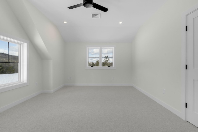 bonus room featuring ceiling fan, vaulted ceiling, and carpet