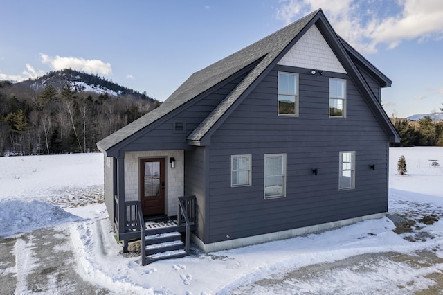 view of front of home featuring a mountain view