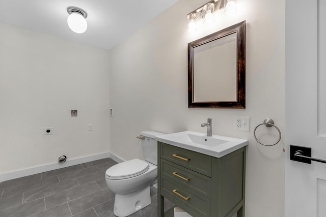 bathroom with tile patterned floors, vanity, and toilet