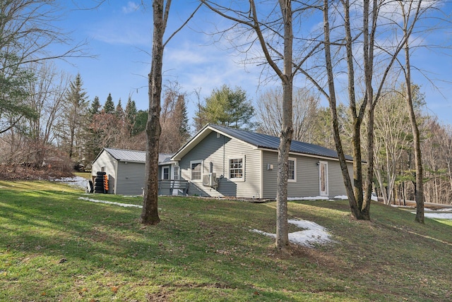 view of property exterior with a yard and cooling unit