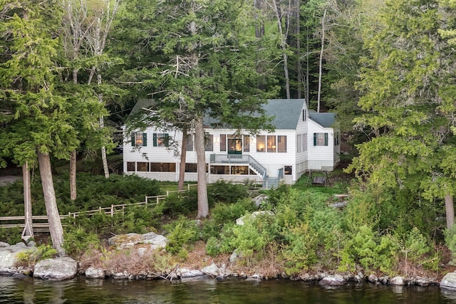137 Birch Ln, Belgrade, ME 04917 - back of property featuring stairs, a water view, and a shingled roof