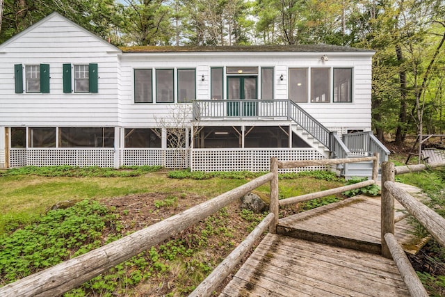 137 Birch Ln, Belgrade, ME 04917 - view of front facade with a deck and stairway