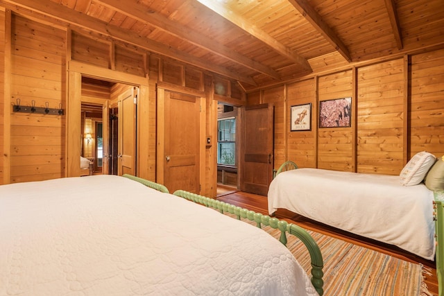 137 Birch Ln, Belgrade, ME 04917 - bedroom featuring wooden walls, wood ceiling with exposed beams, and wood finished floors