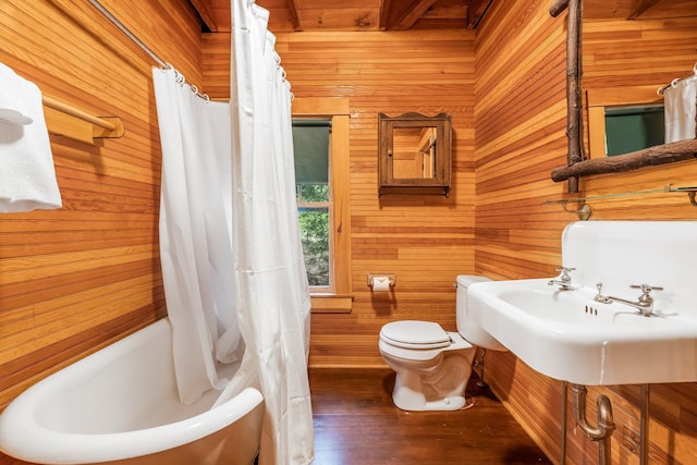 137 Birch Ln, Belgrade, ME 04917 - full bath featuring wooden walls, toilet, shower / bath combo with shower curtain, and wood finished floors