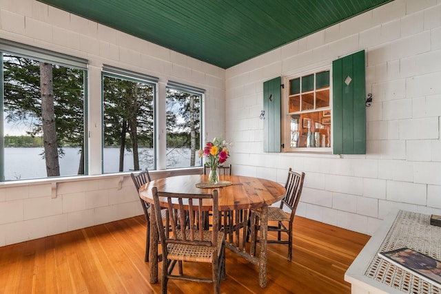 137 Birch Ln, Belgrade, ME 04917 - dining space featuring hardwood / wood-style flooring, healthy amount of natural light, and a water view