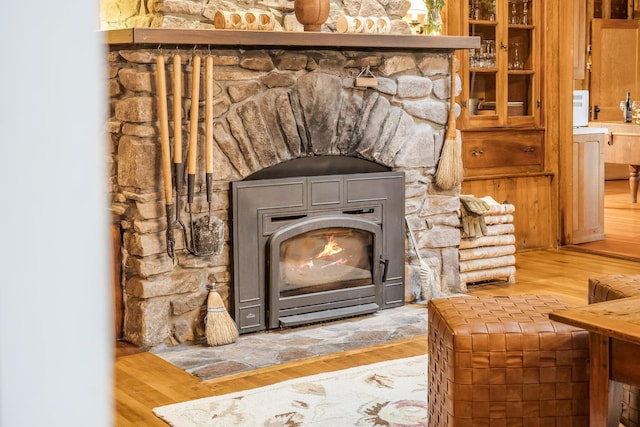 137 Birch Ln, Belgrade, ME 04917 - detailed view of wood finished floors and a fireplace