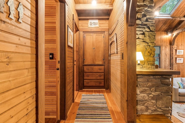 137 Birch Ln, Belgrade, ME 04917 - corridor featuring wooden walls, wood finished floors, and a skylight