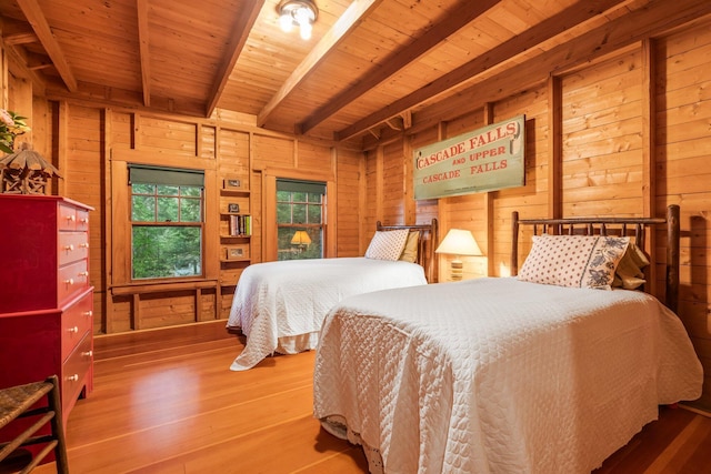 137 Birch Ln, Belgrade, ME 04917 - bedroom featuring wood walls, wood finished floors, and wood ceiling with exposed beams