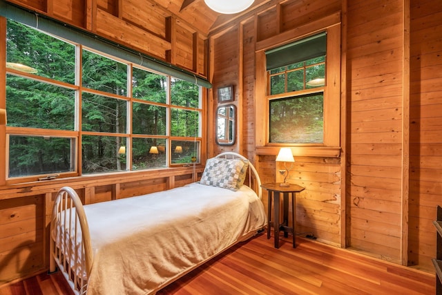137 Birch Ln, Belgrade, ME 04917 - bedroom featuring wooden walls and wood finished floors