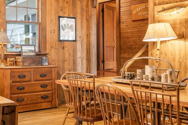 137 Birch Ln, Belgrade, ME 04917 - dining space with wood walls and light wood finished floors