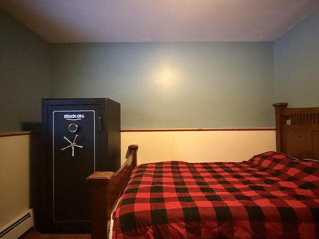 bedroom with a baseboard heating unit