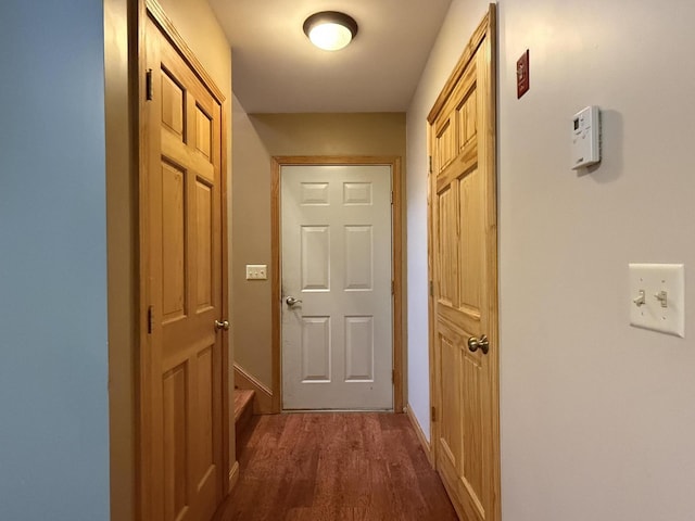 hall with dark hardwood / wood-style floors