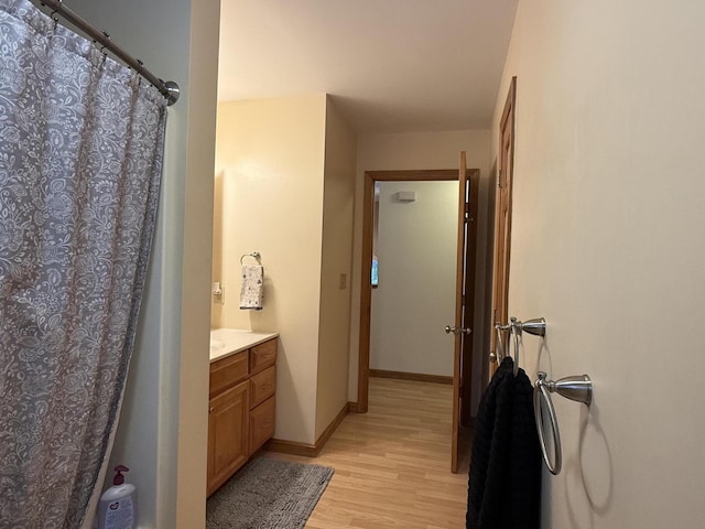 bathroom with wood-type flooring and vanity