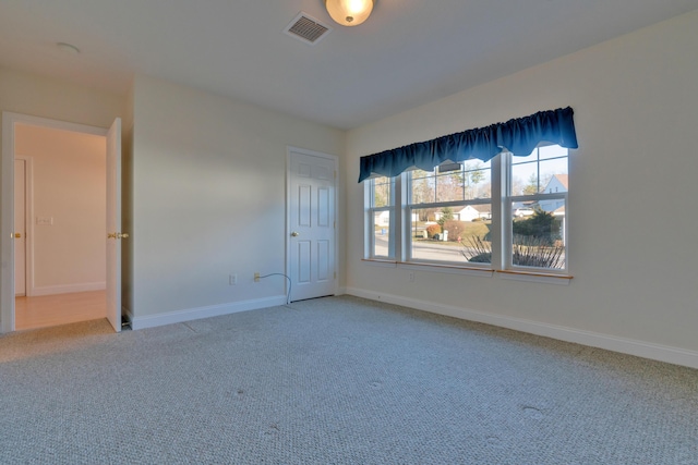 empty room featuring carpet flooring