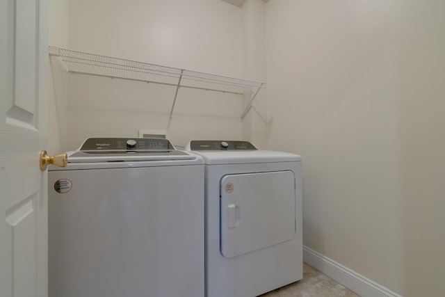 laundry room with independent washer and dryer