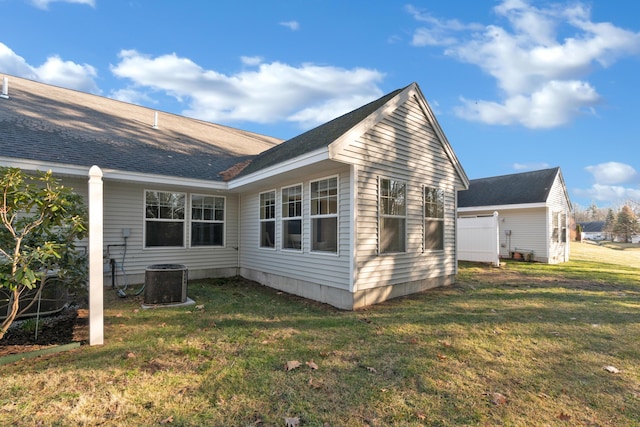 exterior space featuring a lawn and central AC unit