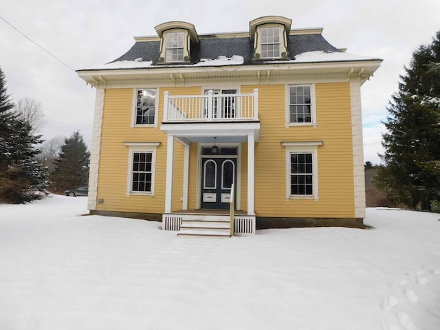 view of front of home with a balcony