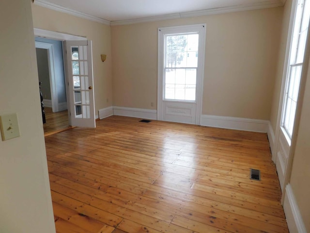 unfurnished room with light hardwood / wood-style floors and ornamental molding