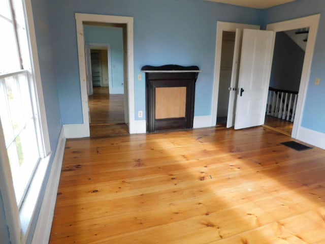 unfurnished living room with light wood-type flooring