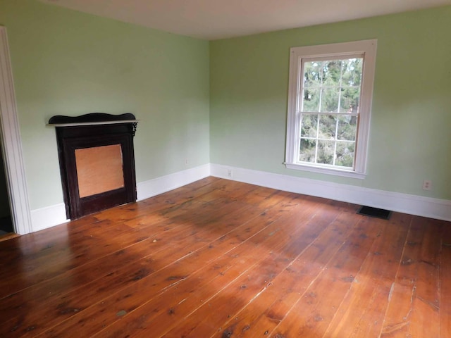 spare room featuring hardwood / wood-style floors