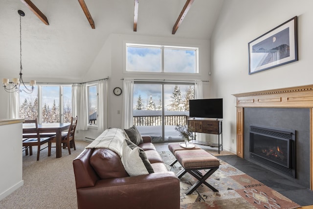 carpeted living room featuring plenty of natural light, high vaulted ceiling, a chandelier, and beamed ceiling