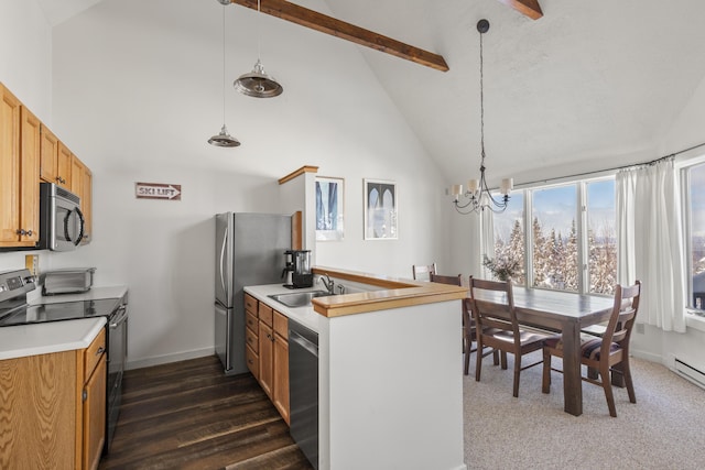 kitchen featuring sink, high vaulted ceiling, pendant lighting, and appliances with stainless steel finishes