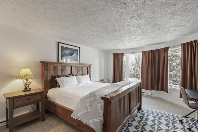 carpeted bedroom with a textured ceiling and baseboard heating