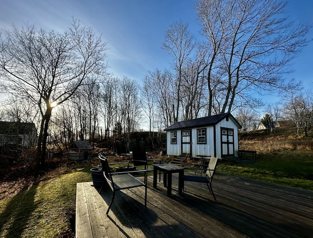 wooden terrace with a shed