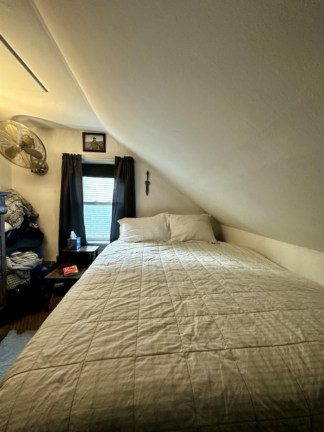 unfurnished bedroom featuring vaulted ceiling