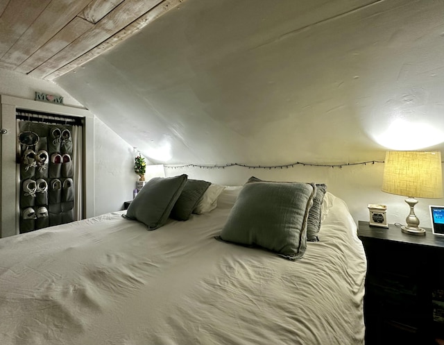 bedroom featuring wooden ceiling and lofted ceiling