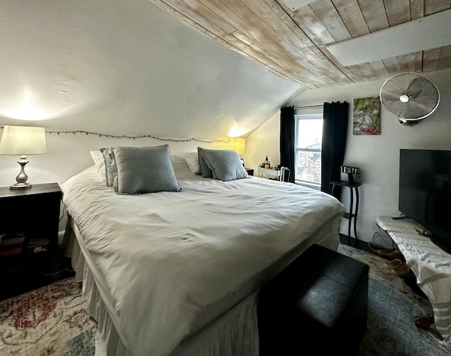 carpeted bedroom with wood ceiling and vaulted ceiling