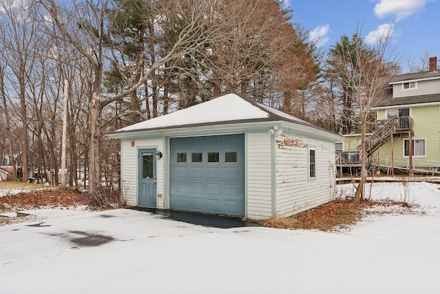 view of snow covered garage