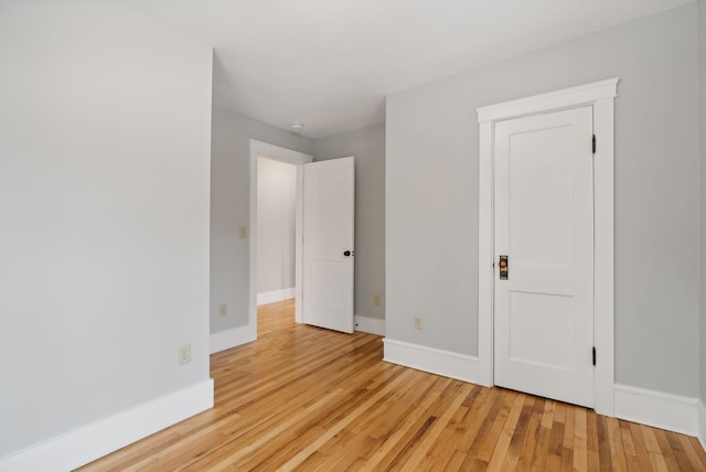 unfurnished bedroom with light wood-type flooring