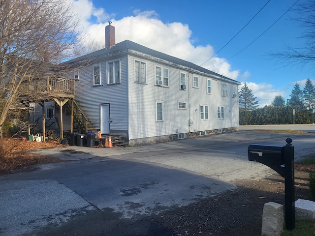 view of home's exterior featuring a deck