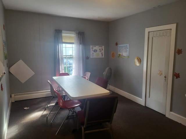 dining space with a baseboard heating unit