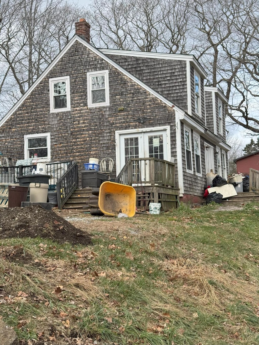 exterior space featuring a lawn and a deck