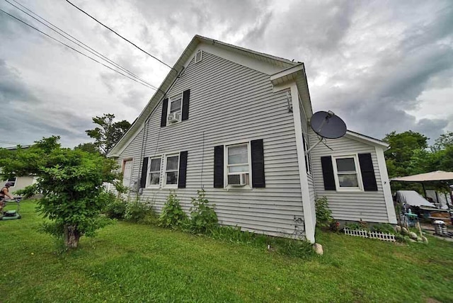 view of home's exterior with a lawn