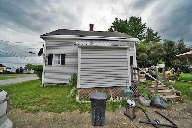 view of home's exterior featuring a yard