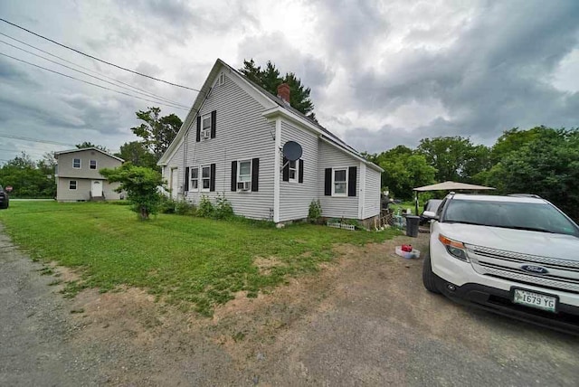 view of property exterior featuring a yard