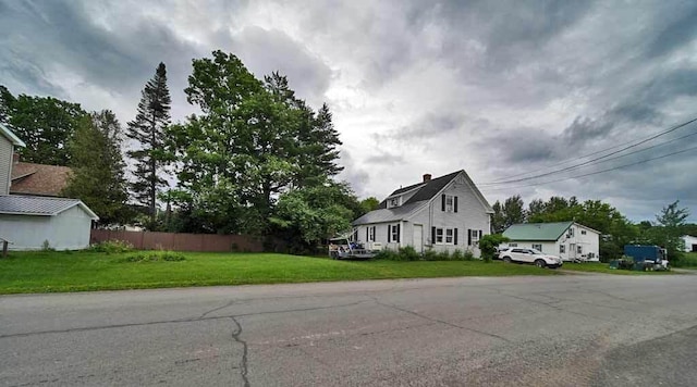 view of side of home featuring a lawn