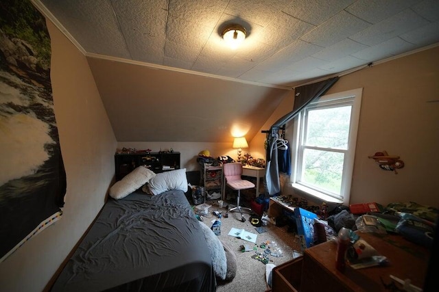 carpeted bedroom with crown molding and vaulted ceiling