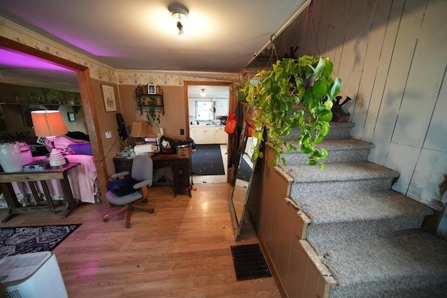 interior space featuring hardwood / wood-style flooring and wood walls