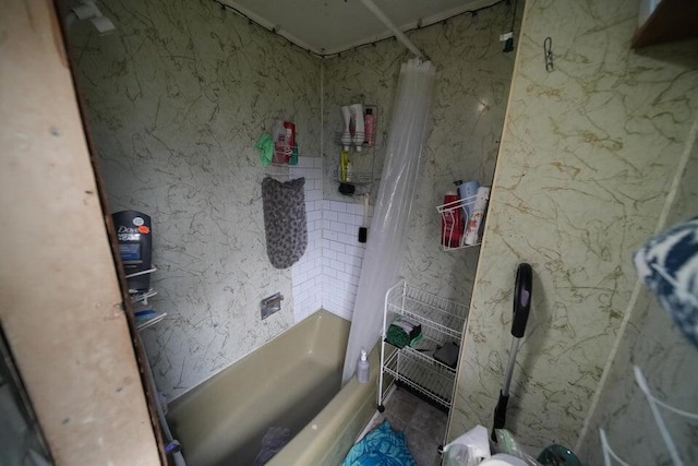 bathroom with shower / bath combo with shower curtain