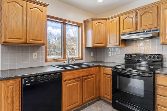 kitchen featuring sink, backsplash, and black appliances